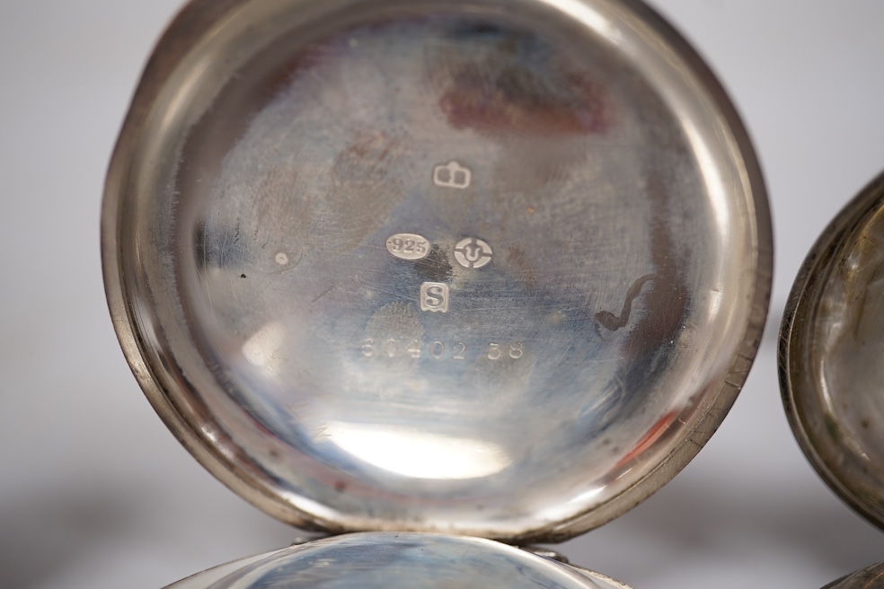 Three early to mid 20th century silver open faced pocket watches, with Roman or Arabic dials and subsidiary seconds, including two keyless and one key wind (Admiral Tacy Watch Co), together with one smaller silver open f